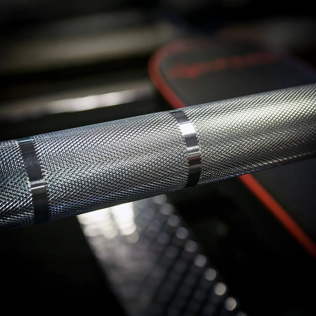 Close-up of a textured metal bar with blurred background