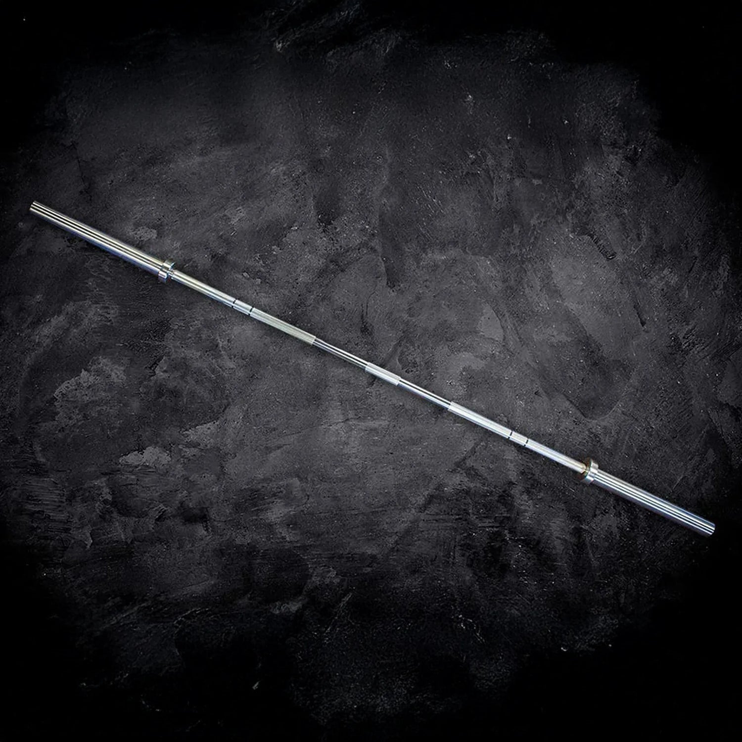 Barbell on a dark textured surface