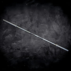 Barbell on a dark textured surface
