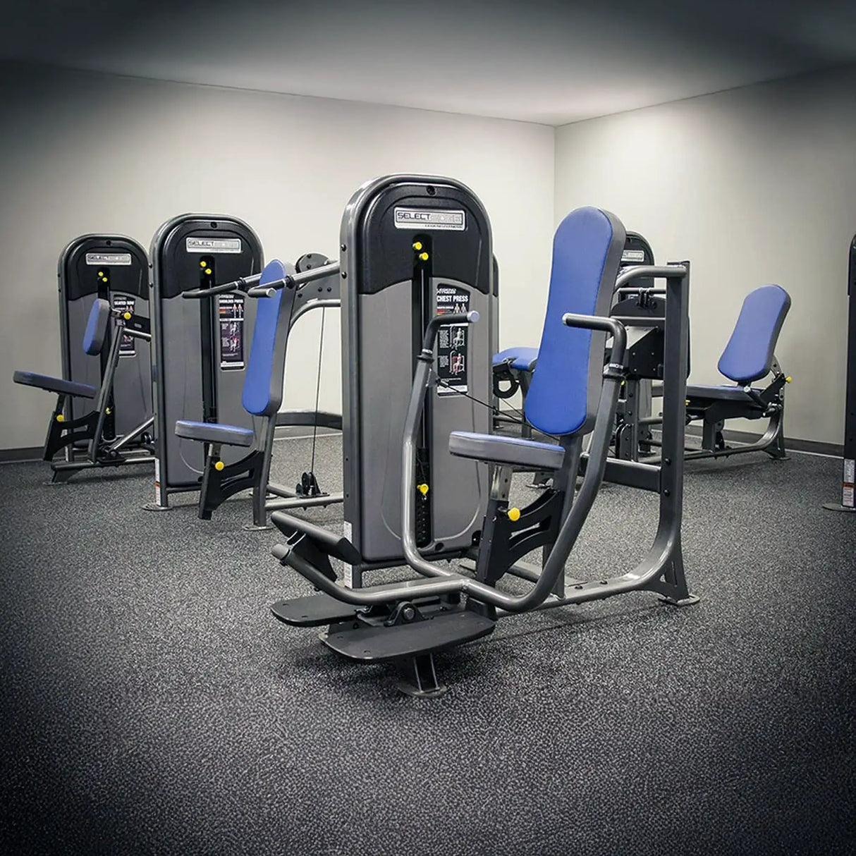 Gym equipment with blue padding in a gym setting