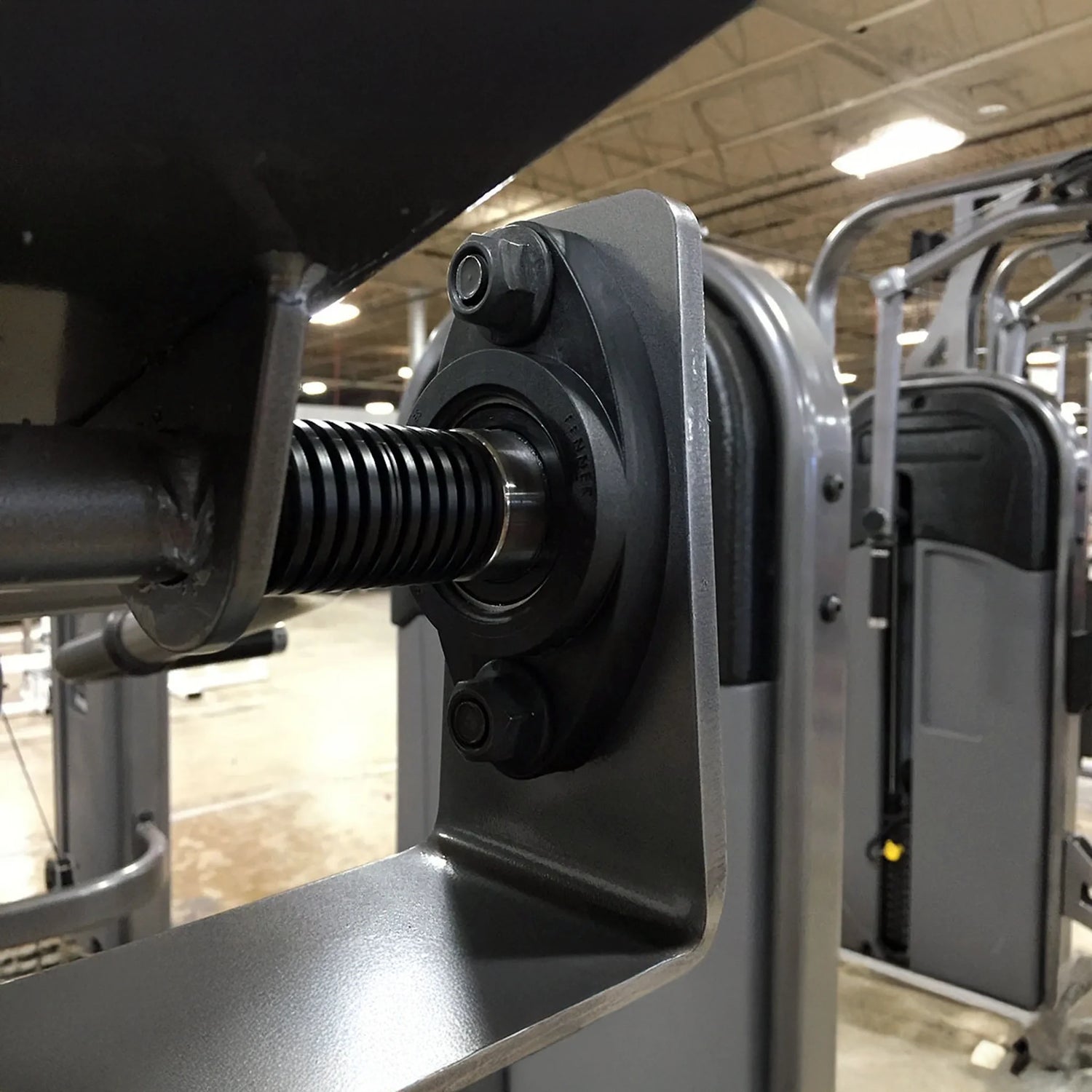 Close-up of a mechanical component in a gym setting
