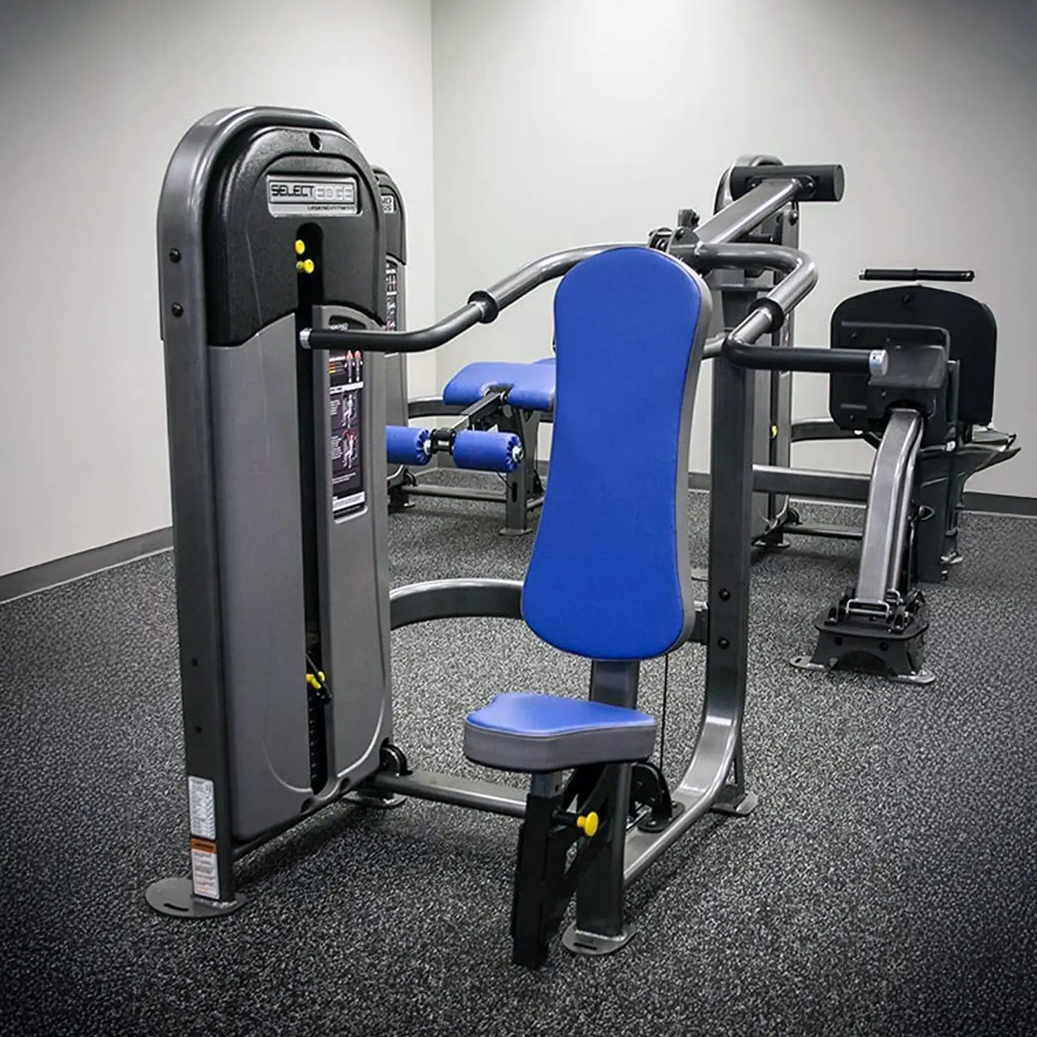 Gym machine with blue padding in a fitness center