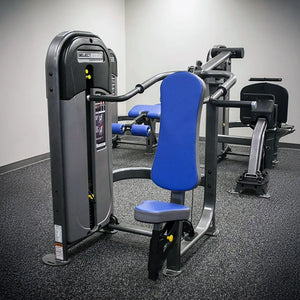 Gym machine with blue padding in a fitness center