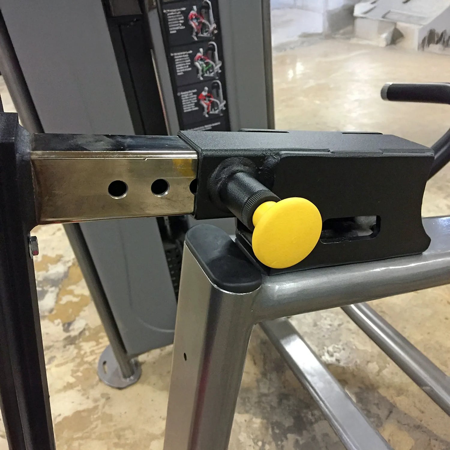 Close-up of a mechanical component with a yellow pop-pin on a blurred background