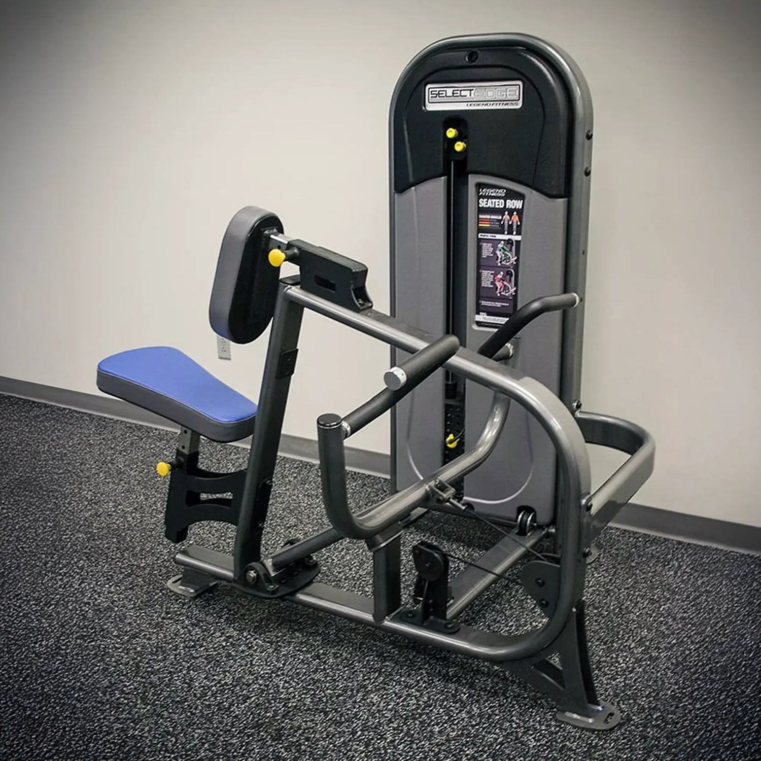 Gym machine with blue seat on a gray floor against a white wall