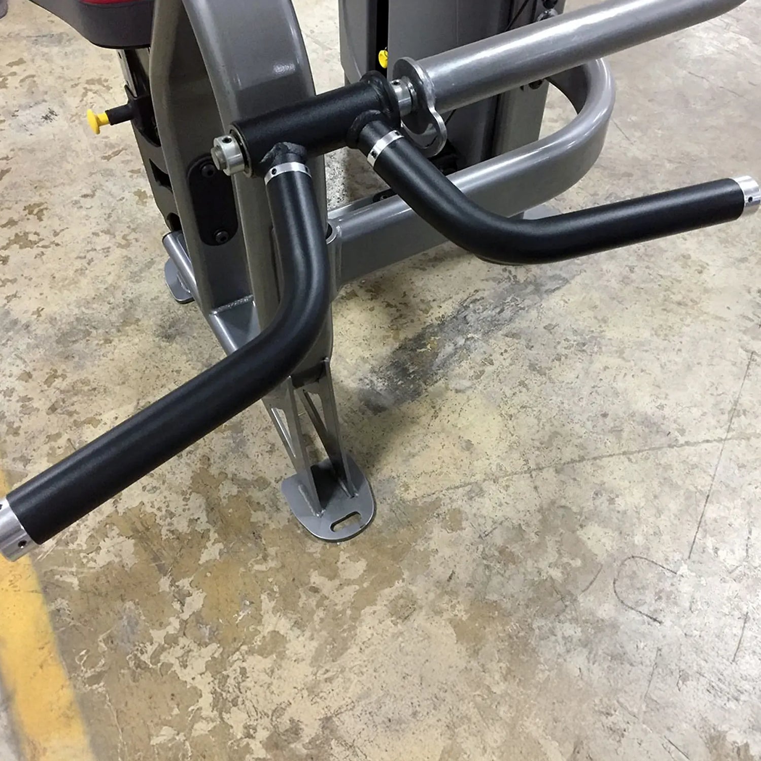 Close-up of a piece of gym equipment on a concrete floor