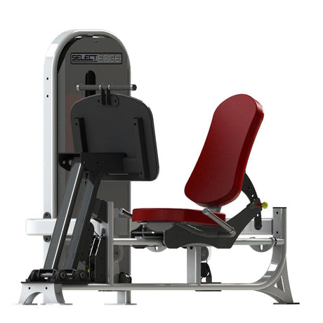 Gym fitness machine with red pads and a gray frame on a white background
