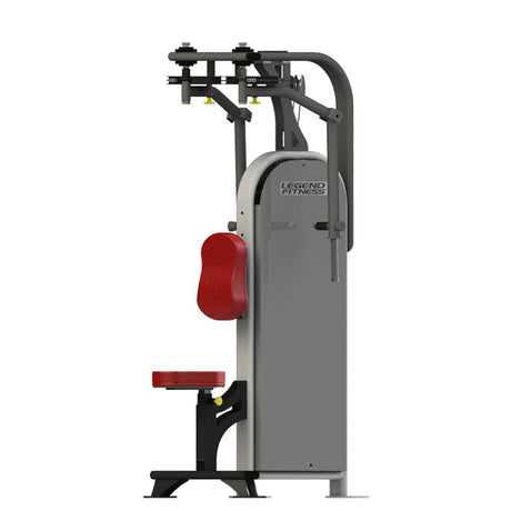 Gym machine with red seat and gray frame on a white background