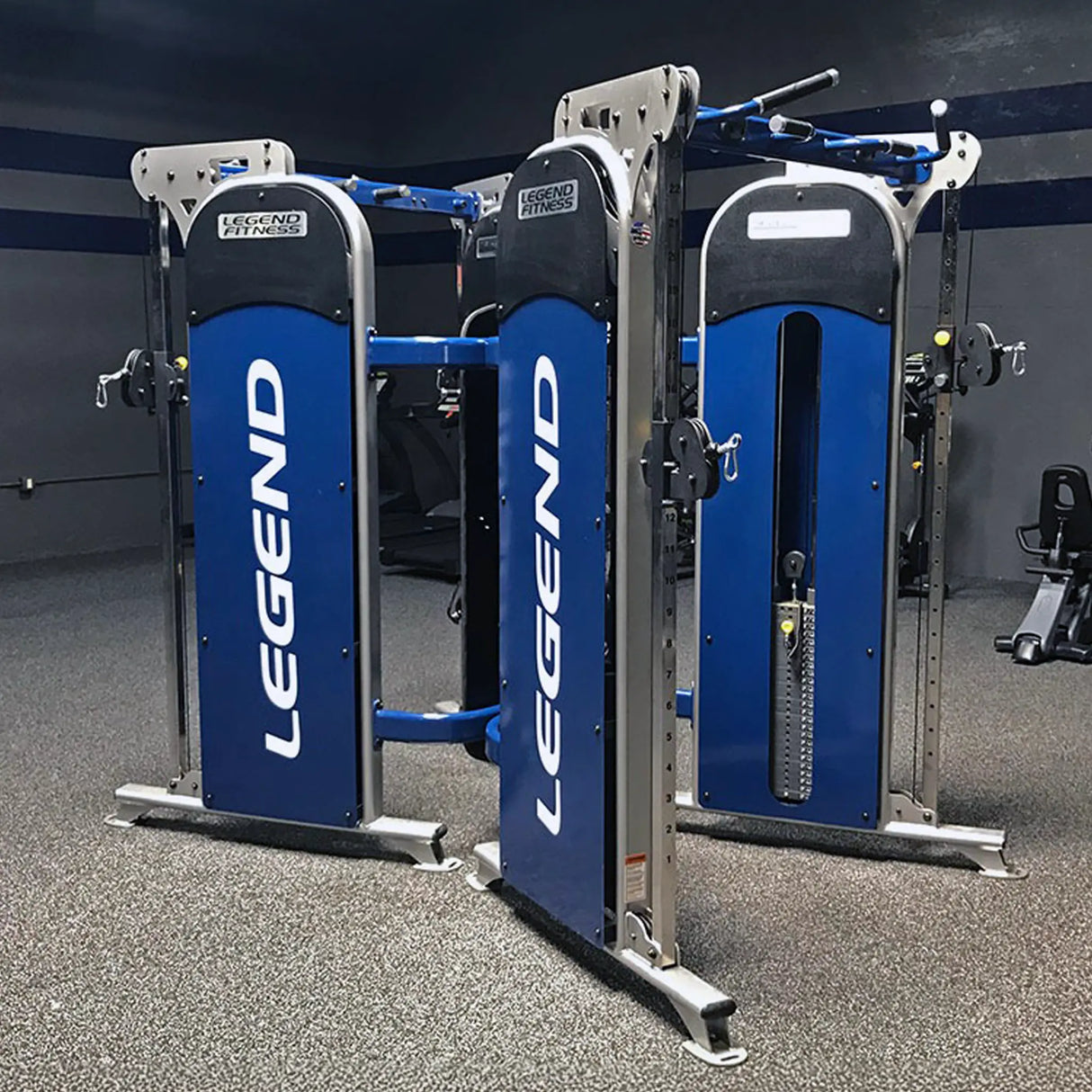 Two back-to-back Legend Fitness functional trainers in a gym setting