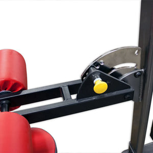 Red foam rollers on a steel mounting arm on a piece of gym equipment with a white background