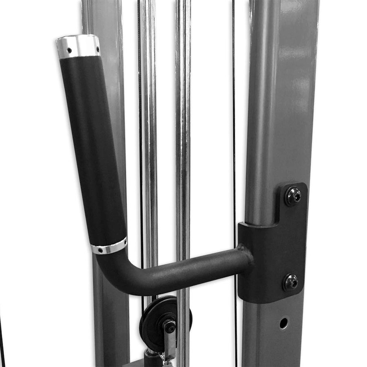 Black handle on a piece of gym equipment with a white background