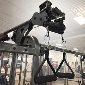 Two black nylon D grip handles hanging from a piece of gym equipment