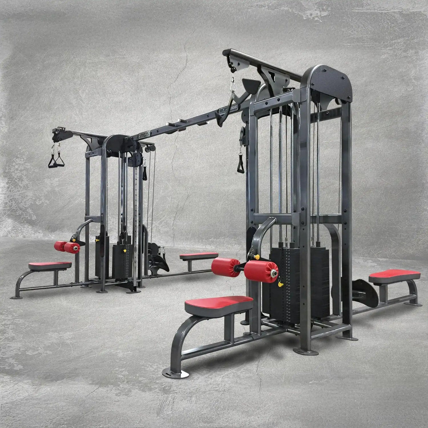 Gym equipment with red padding on a gray floor and background