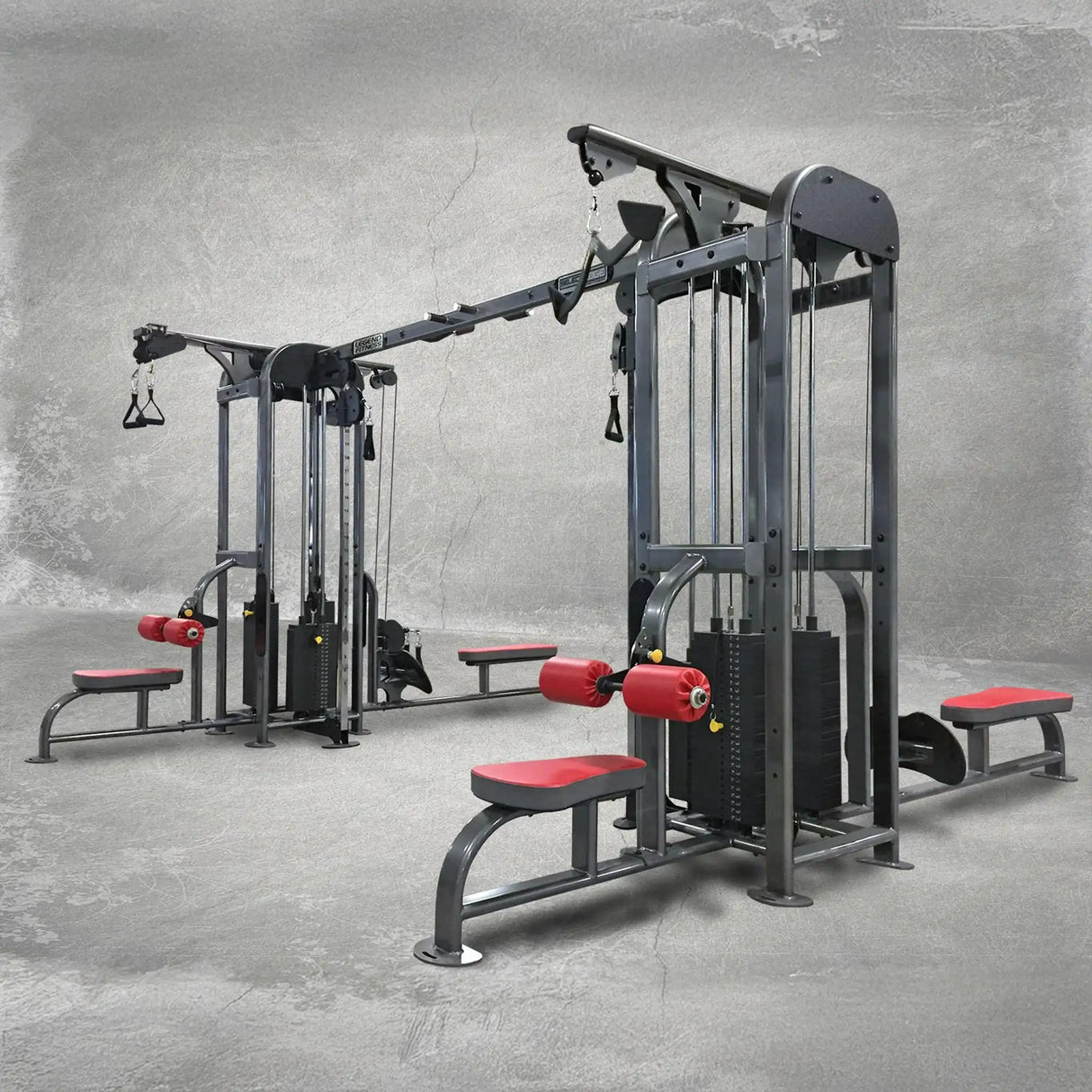 Gym equipment with red padding on a gray floor and background