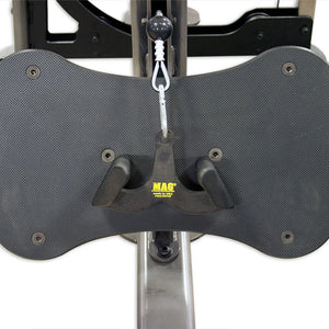 Black UHMW footplate on a gym machine with a MAG brand handleleaning against it