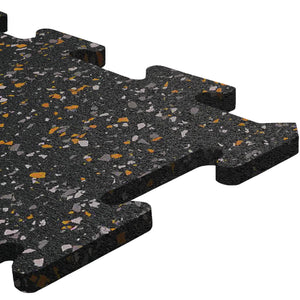 Close-up of an ECORE Athletic 8mm Interlocking Rubber Floor Tile with gray and orange speckles, showcasing puzzle-like edges against a white background.