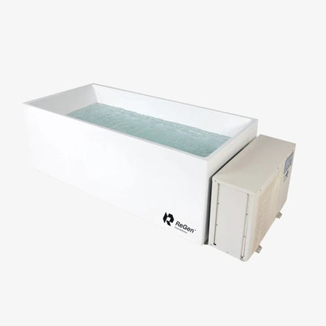 A rectangular cold plunge filled with water with a white exterior and a white external chiller unit on the right side of the plunge