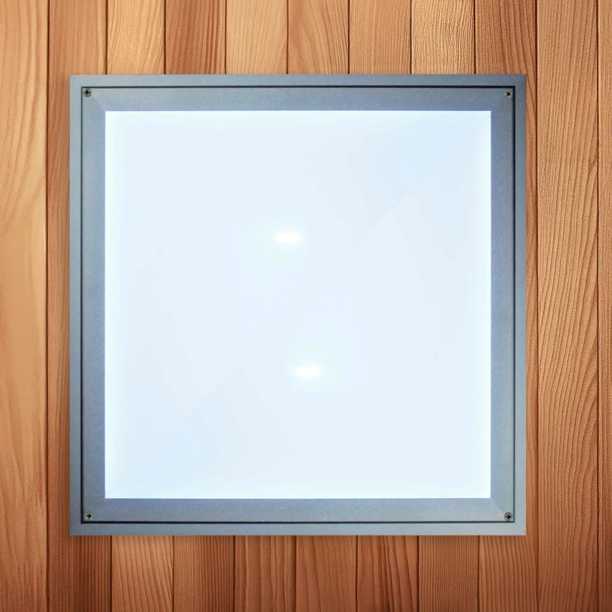 Chromotherapy lighting panel cover which is white and found inside of a wooden sauna