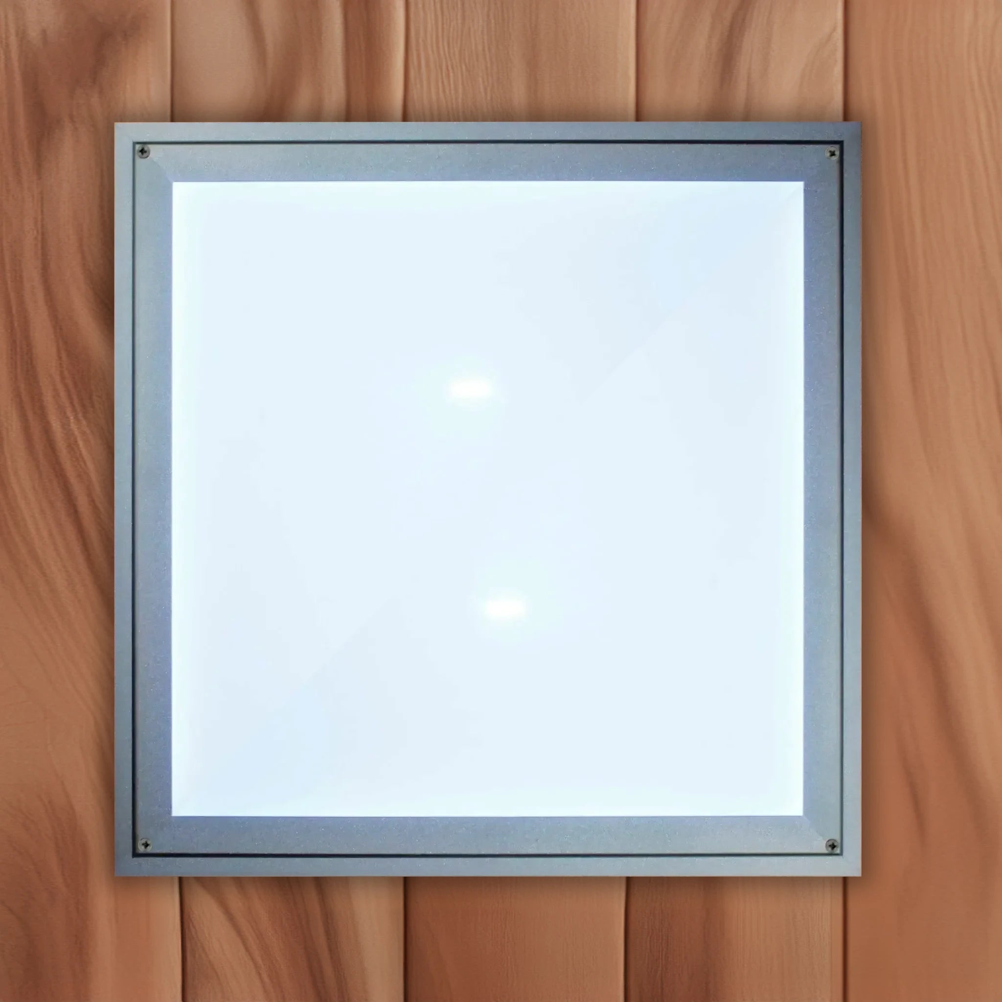 The white cover on a chromotherapy lighting system found inside of a Canadian red cedar sauna sold by Blue Sky Fitness Supply