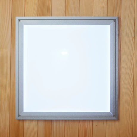 Image of an overhead chromotherapy light in a sauna which is square and bright