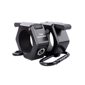 Black metal barbell collars by Lock-Jaw with the model name 'The Machine' written on the side in white letters