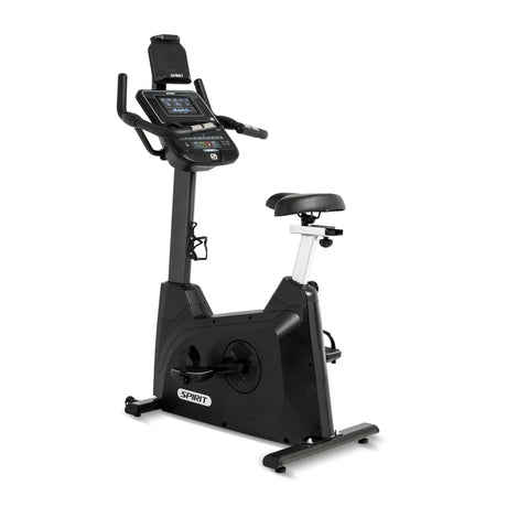 The Spirit Fitness XBU55 Upright Bike by Spirit Fitness in matte black features a digital LCD console, tablet holder, adjustable seat, ergonomic handlebars, and water bottle holder, shown on a white background.