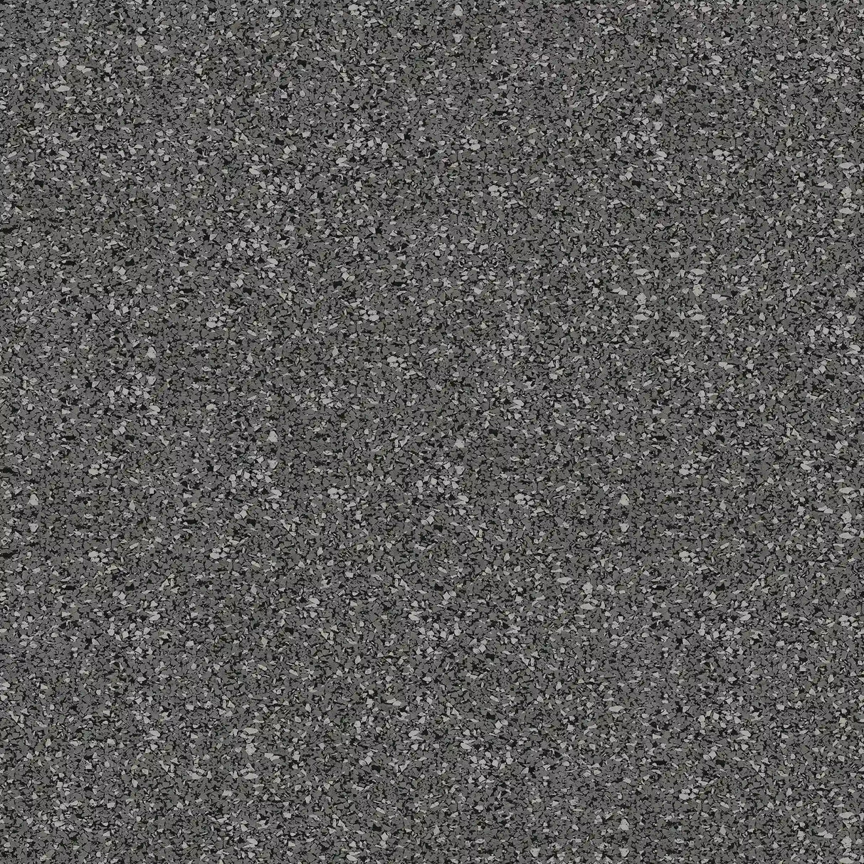 Close-up of ECORE Athletic’s 8mm Interlocking Rubber Floor Tiles, showing a textured, grainy surface with small scattered particles and a dark grey finish.