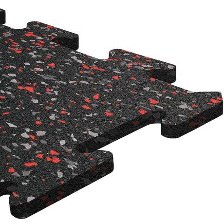 Close-up of an ECORE Athletic ECORE Rubber Floor Tiles - 8mm Interlocking tile in black with red and gray speckles, featuring puzzle-like edges for easy assembly—ideal for gyms or play areas—shown on a white background.
