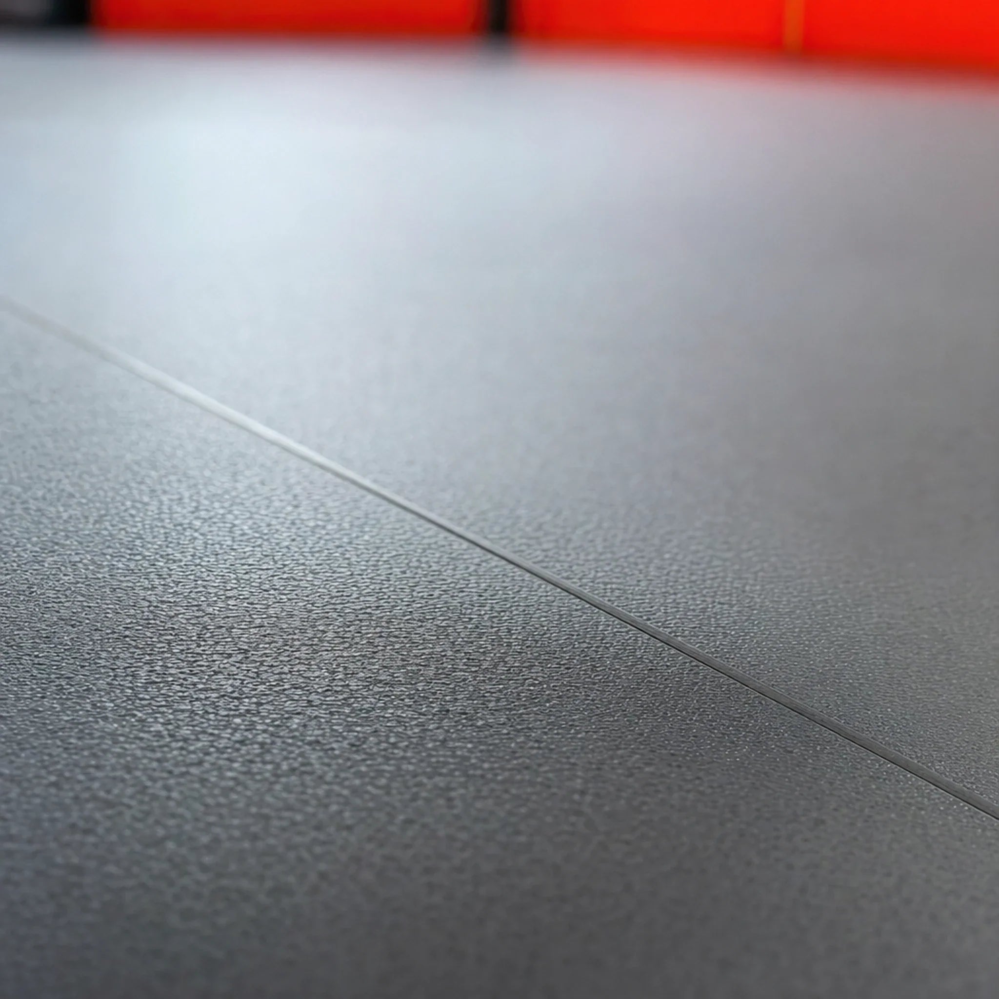 Finished heat-welded seam after ECORE Restorative Motivate Weld Rod was welded in and trimmed flush with the floor