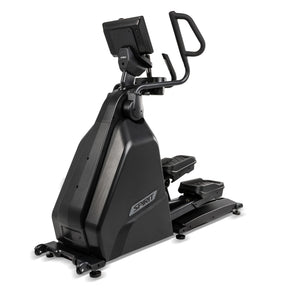 The Spirit Fitness CE1000ENT Elliptical by Spirit Fitness features a black frame with a tiltable console, dual moving handlebars, and textured foot platforms, displayed at a front-right angle on a white background.