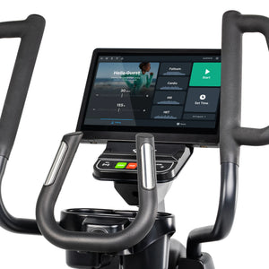 Close-up of the Spirit Fitness CE1000ENT Elliptical console and control panel shows the touchscreen, NFC tap point, Start and Stop buttons, and Level adjustment controls between the handlebar grips. Brand: Spirit Fitness.