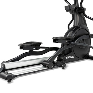 A close-up of the Spirit Fitness CE800 Elliptical highlights its black pedals, sturdy base, and flywheel, with the Spirit Fitness brand name visible on the side.