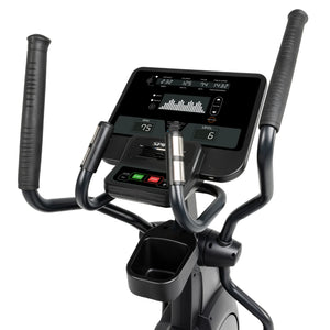 Close-up of the Spirit Fitness CE800 Elliptical console by Spirit Fitness, showing workout metrics like time, speed, distance, RPM, calories, and heart rate, with visible handlebars and control buttons in the foreground.