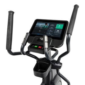 Close-up of Spirit Fitness CE800ENT Elliptical’s handlebars and digital display, showing workout options and stats. The Spirit Fitness console features a cup holder and multiple control buttons below the screen.