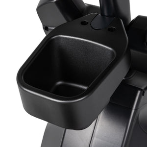 Close-up of a black plastic cup holder attached to the Spirit Fitness CE850 Elliptical by Spirit Fitness, designed to securely hold a water bottle or other small items during your workout.