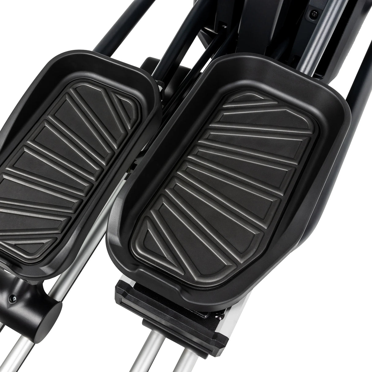 Close-up view of two black textured foot pedals on the Spirit Fitness CE850 Elliptical by Spirit Fitness, with metal rods visible underneath.