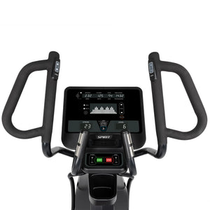 Close-up of the Spirit Fitness CE850 Elliptical’s console and handlebars. The digital display shows speed, time, distance, calories, pulse, and a heart rate graph. Control buttons from Spirit Fitness are located below the screen.