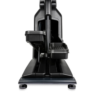 Front view of the Spirit Fitness CE900 Elliptical by Spirit Fitness, featuring black foot pedals and a sturdy base in a modern, sleek design against a white background.