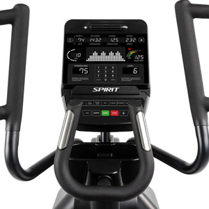 Close-up of the Spirit Fitness CE900 Elliptical control panel and handlebars, showing workout data like time, distance, calories, heart rate, and resistance level on a digital display.