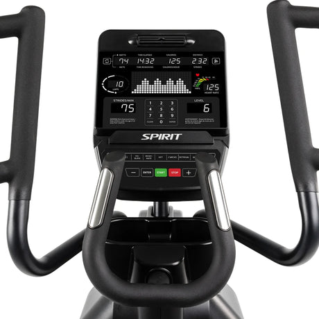 Close-up of the Spirit Fitness CE900 Elliptical control panel and handlebars, showing workout data like time, distance, calories, heart rate, and resistance level on a digital display.