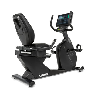 Front angled view of the black Spirit Fitness CR1000ENT Recumbent Bike showing the reclined seat with contoured backrest, cup holders, side handlebars, and elevated touchscreen console.