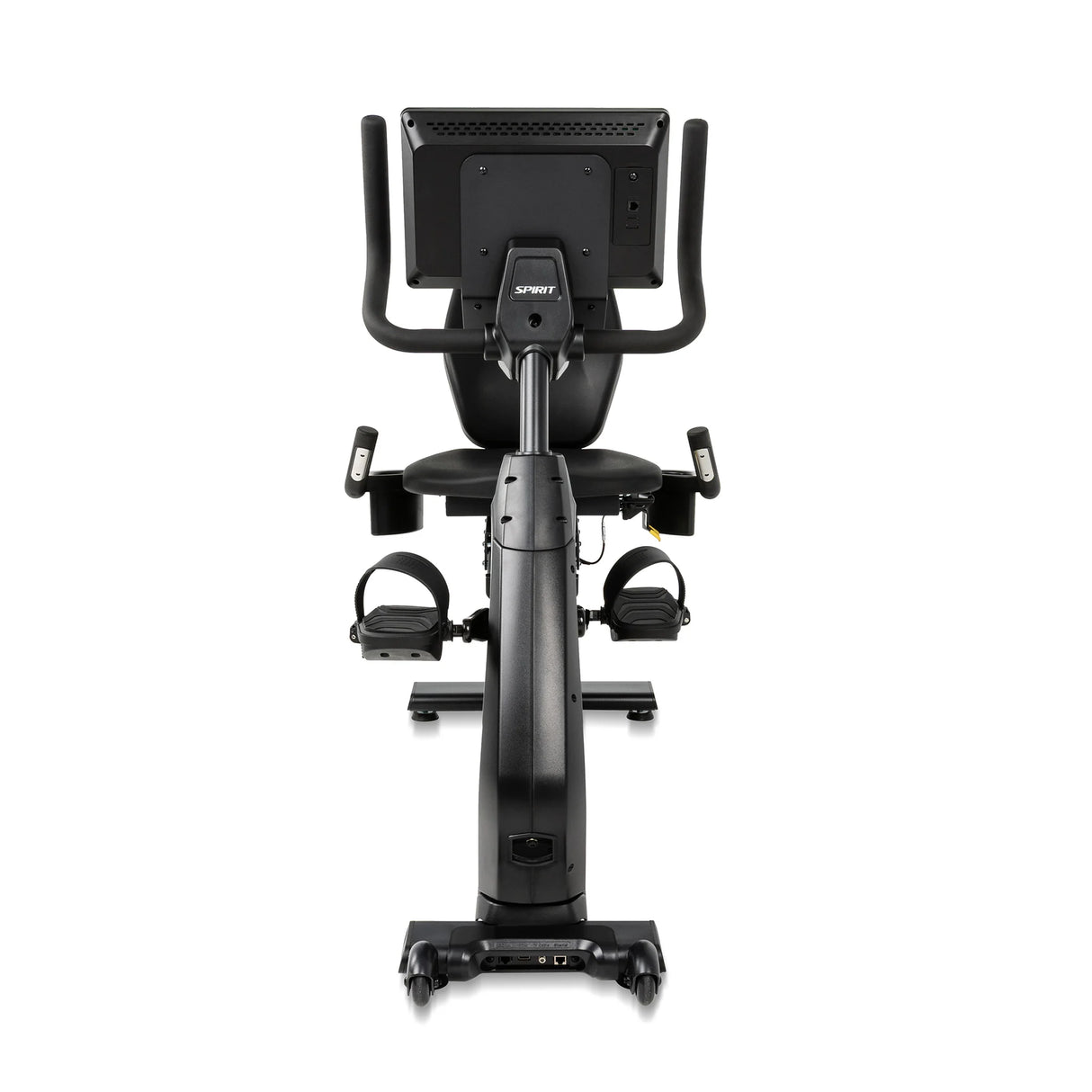 Rear view of the Spirit Fitness CR1000ENT Recumbent Bike showing the back of the console mount, the seat backrest, dual pedals with straps, and the connectivity ports at the base of the frame.