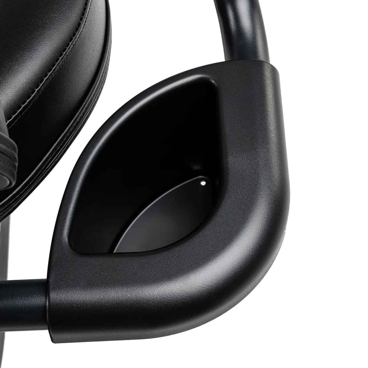 Close-up of the Spirit Fitness CR800 Recumbent Bike’s black armrest with built-in cup holder, attached to a padded black leather seat by Spirit Fitness.