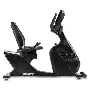 The Spirit Fitness CR900 Recumbent Bike features a black frame, cushioned seat and backrest, pedals, and a front-mounted digital console. The Spirit Fitness brand name appears near the base.