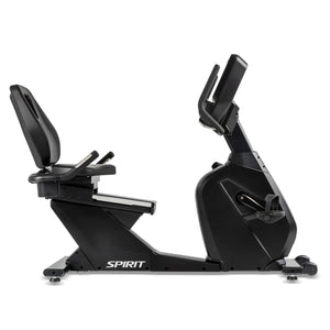 The Spirit Fitness CR900 Recumbent Bike by Spirit Fitness is shown in matte black with a padded seat and backrest, side handlebars, adjustable pedals, and front console, displayed side profile against a white background.