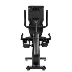 The Spirit Fitness CR900 Recumbent Bike by Spirit Fitness is shown from the front, highlighting its seat, pedals, handlebars, digital console screen, and sturdy frame against a white background.