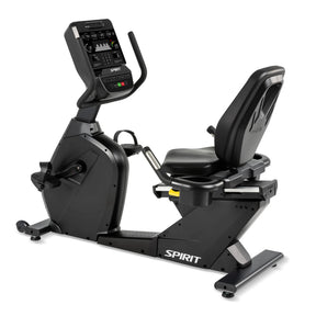 The Spirit Fitness CR900 Recumbent Bike is a black exercise bike with a digital display, padded seat with back support, pedals, and the Spirit Fitness logo on the base.