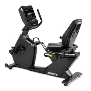 The Spirit Fitness CR900 Recumbent Bike is a black exercise bike with a digital display, padded seat with back support, pedals, and the Spirit Fitness logo on the base.