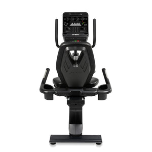 The Spirit Fitness CR900 Recumbent Bike by Spirit Fitness is shown from the rear, featuring a digital console, handlebars, and a cushioned backrest seat on a sturdy base.