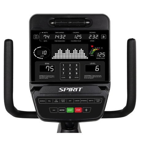 Close-up of the Spirit Fitness CR900 Recumbent Bike console by Spirit Fitness, showing workout stats like watts, time, calories, distance, laps, RPM, and heart rate. The console features multiple buttons and black handlebars on each side.